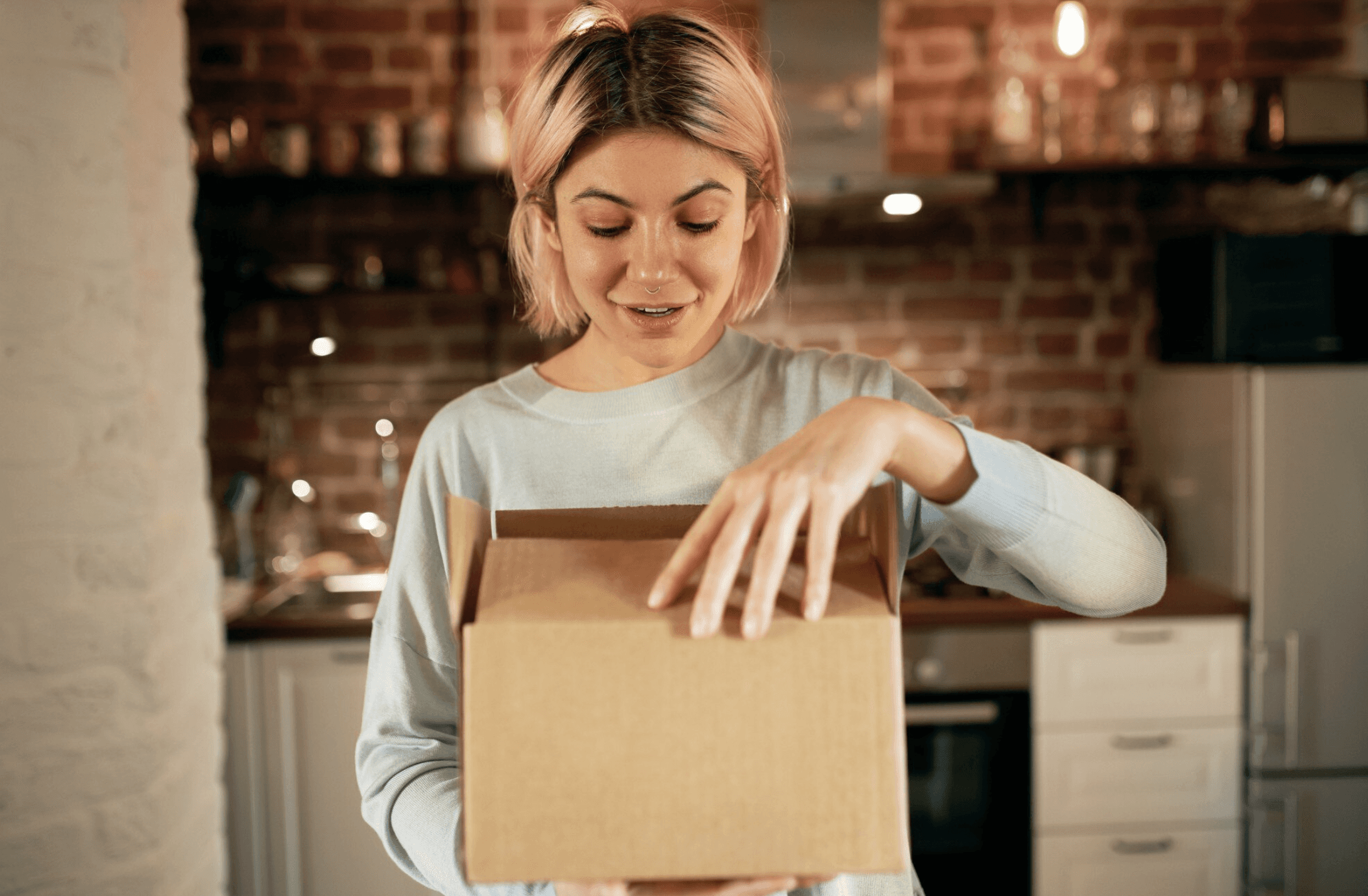 two ladies looking at a laptop and smiling