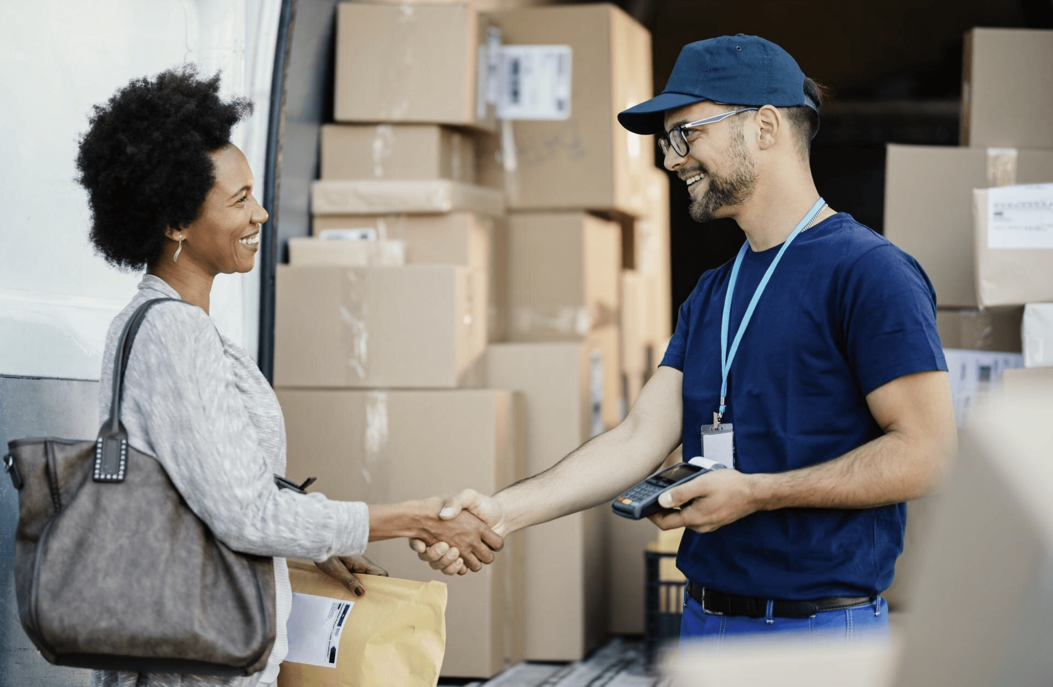 husband and wife working happily on a laptop